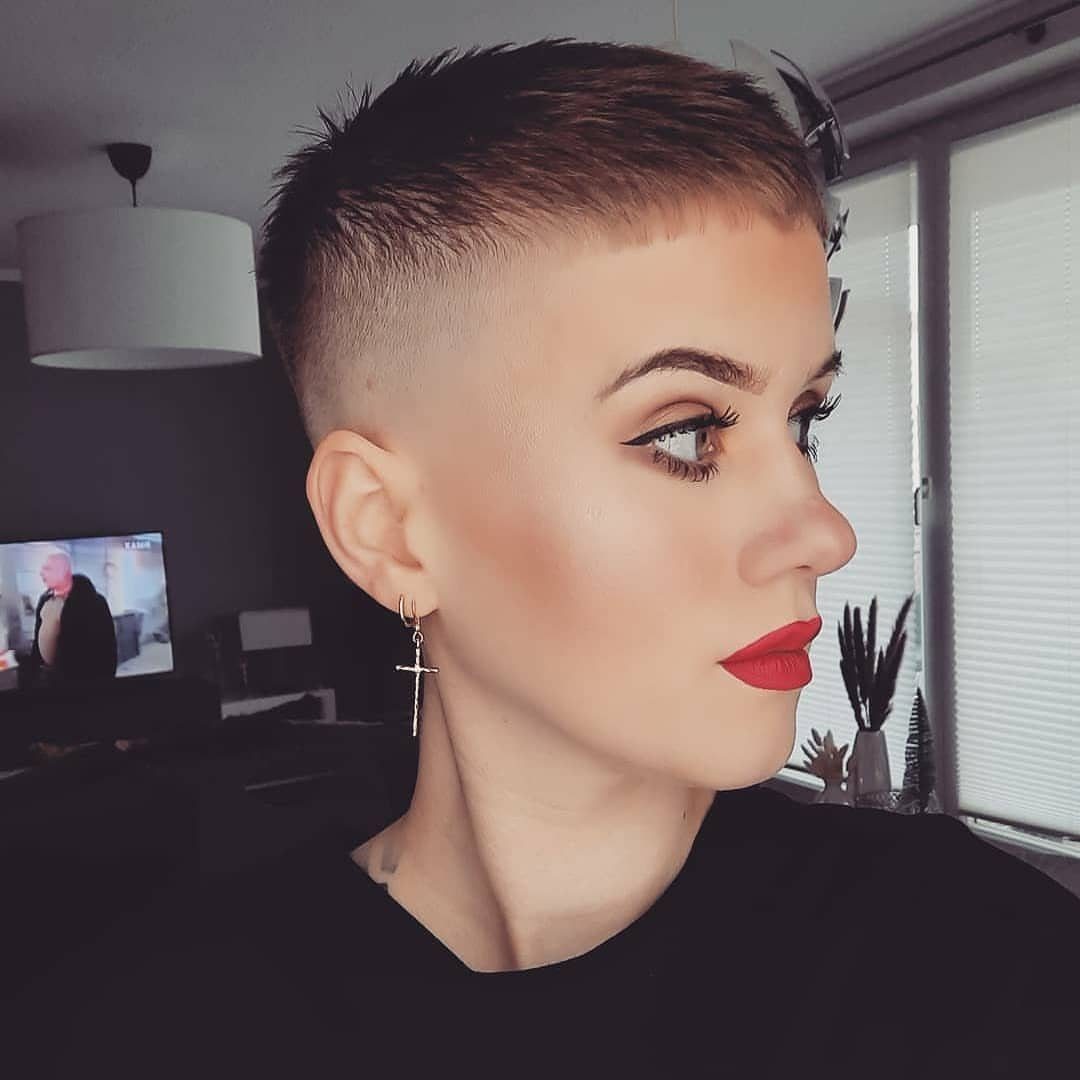 Person wearing a high-fade French crop with short textured hair on top