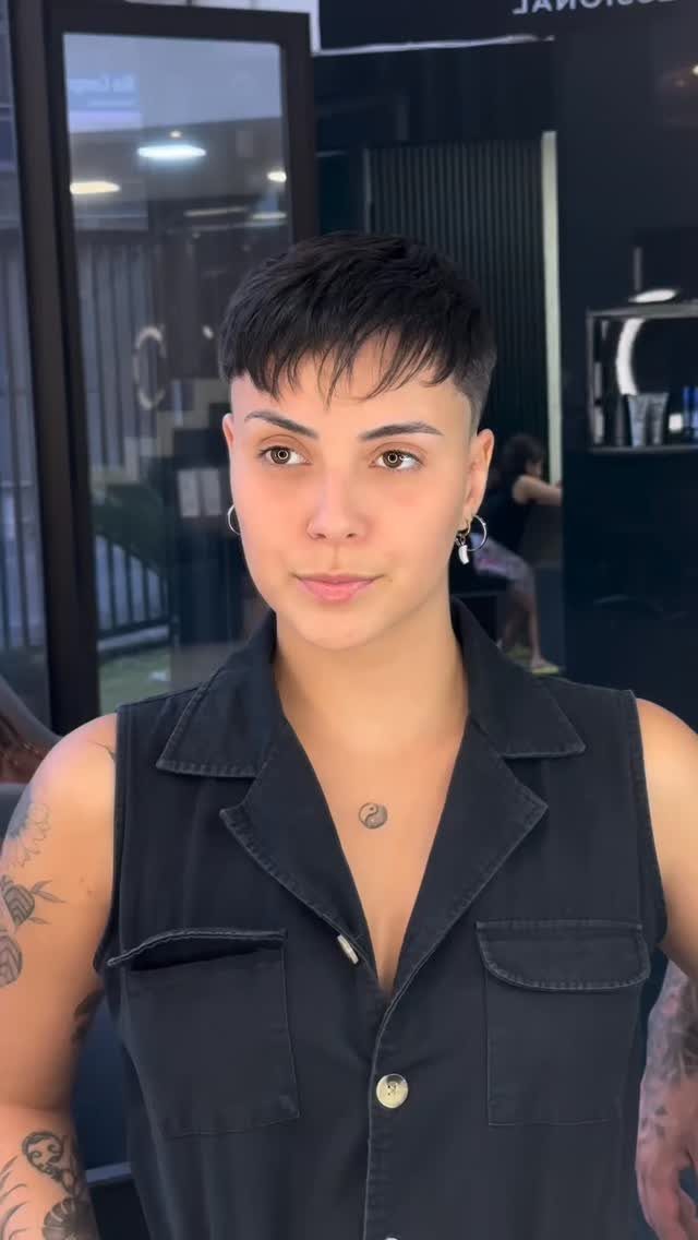Person showing a short textured French crop with choppy fringe