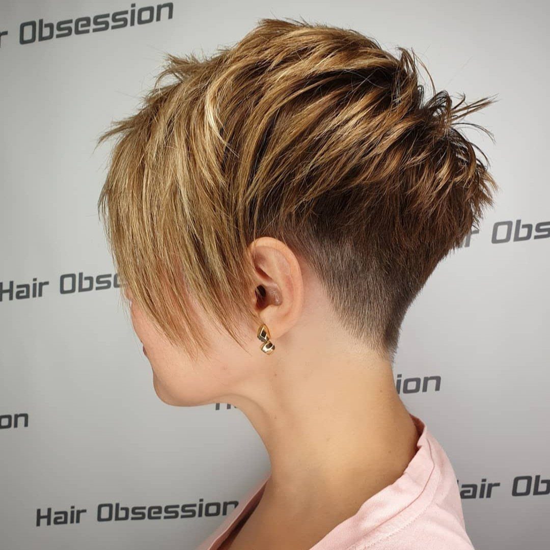 Short asymmetrical crop with long blonde side fringe and tapered nape