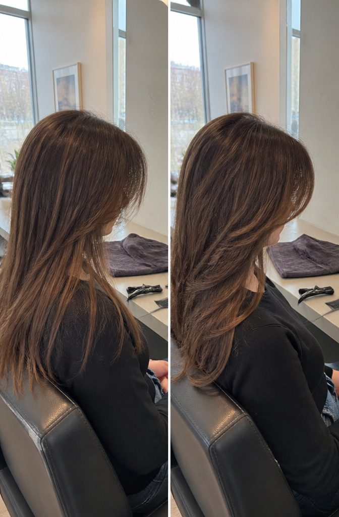 Graduated full curtain bangs extending from brows toward cheekbones