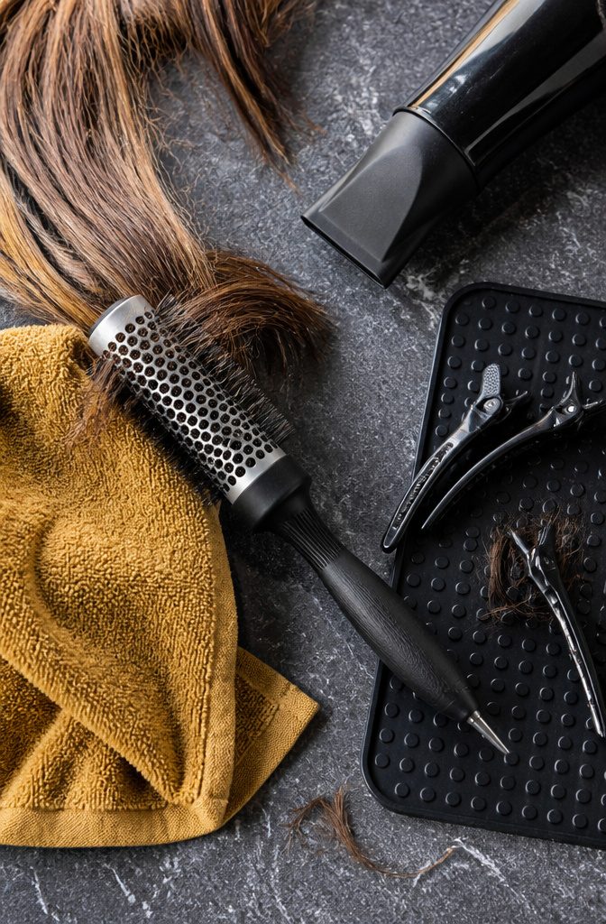 Vented ceramic round brush beside short fine hair and bangs