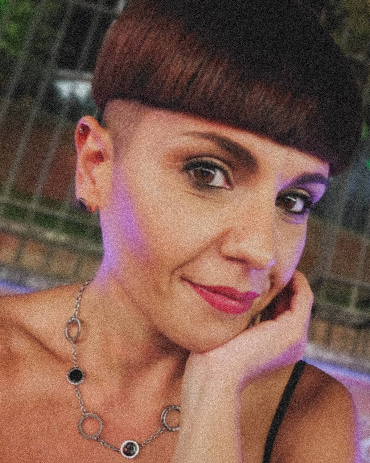 Person poses showing a rounded bowl haircut with straight fringe