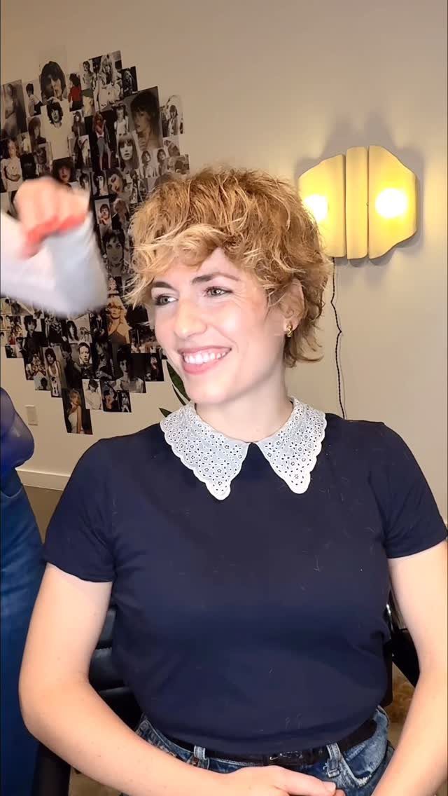 Woman with tousled blonde long pixie and short piecey bangs