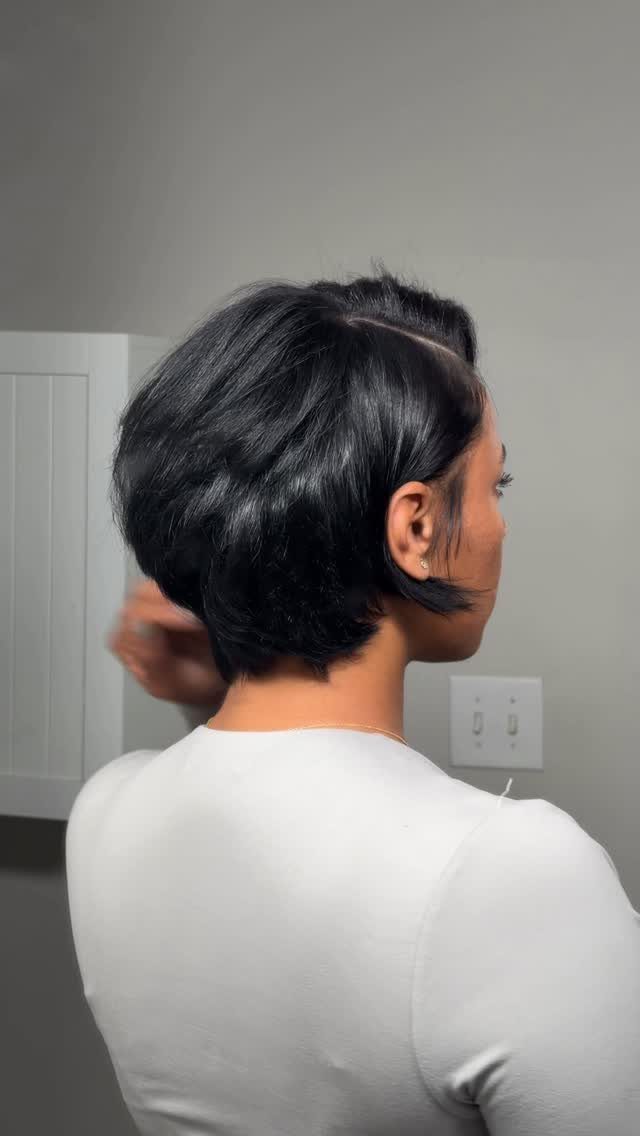 Side-parted dark bixie with volume shown from behind