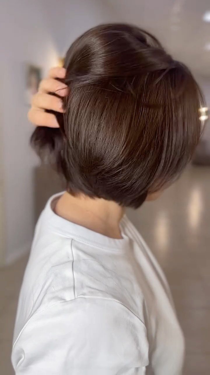 Dark brown angled bob with softly layered ends tucked under