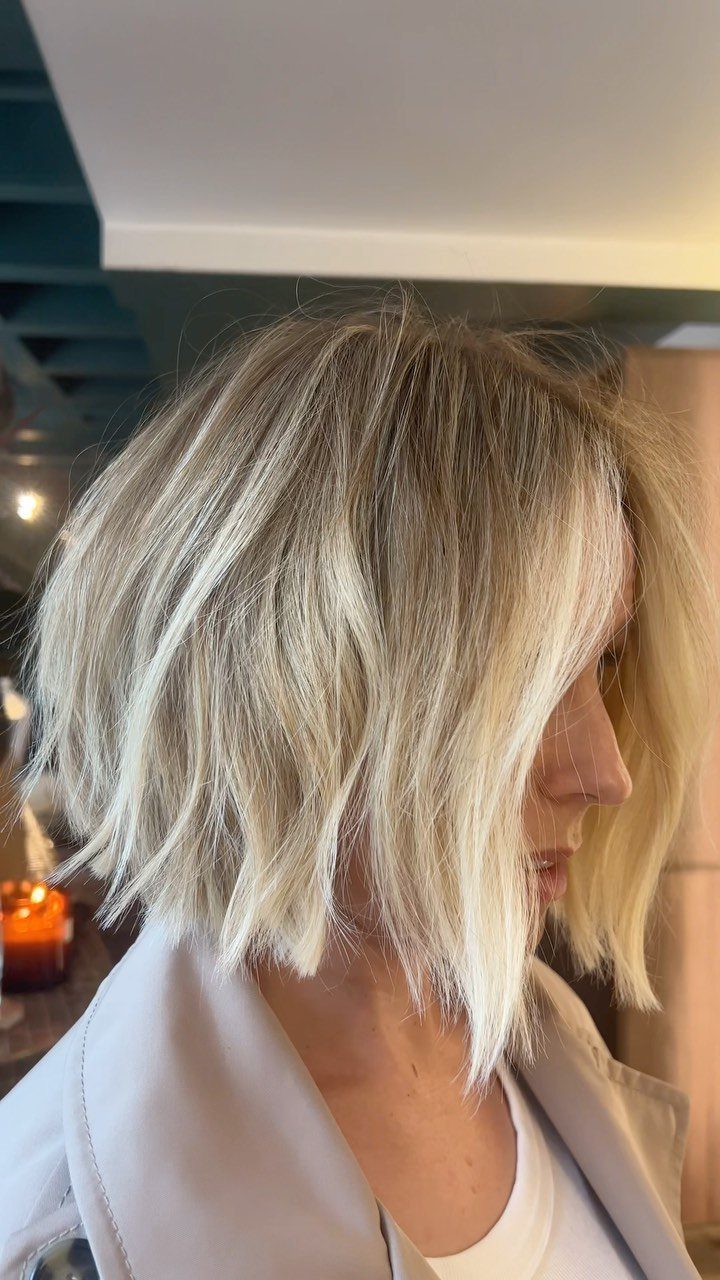 Short blonde bob with piecey layers and soft fringe