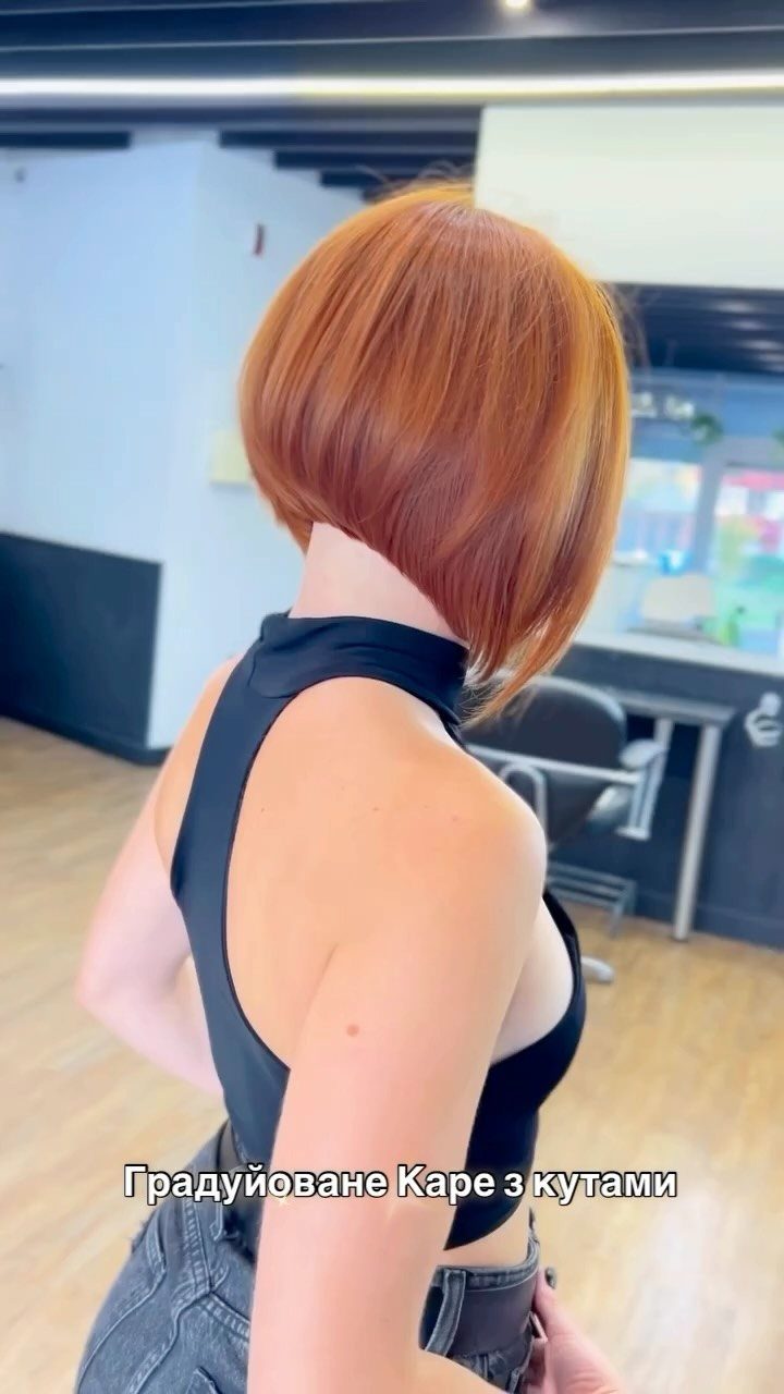 Copper stacked layered bob viewed from the side in a salon