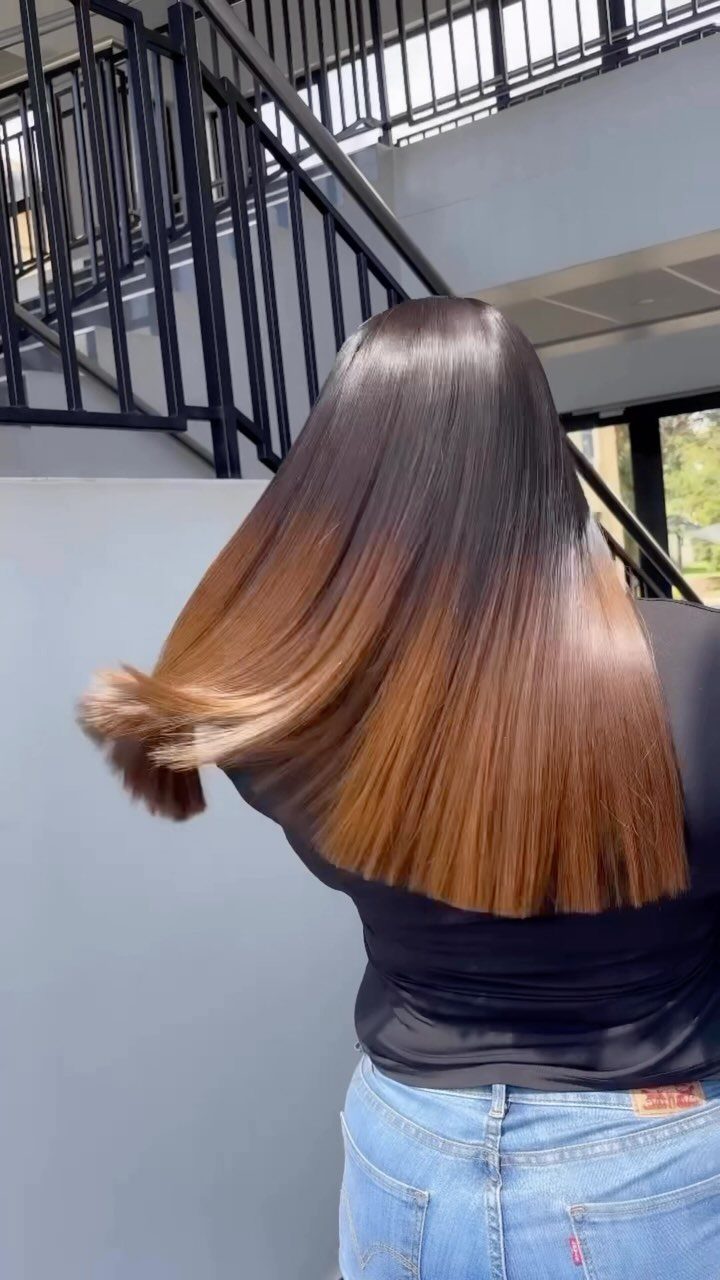 Straight ombre lob transitions from dark roots to lighter brown ends