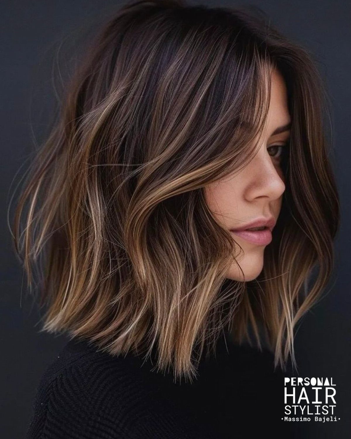 Woman with a highlighted, wavy shoulder-length bob and face-framing layers