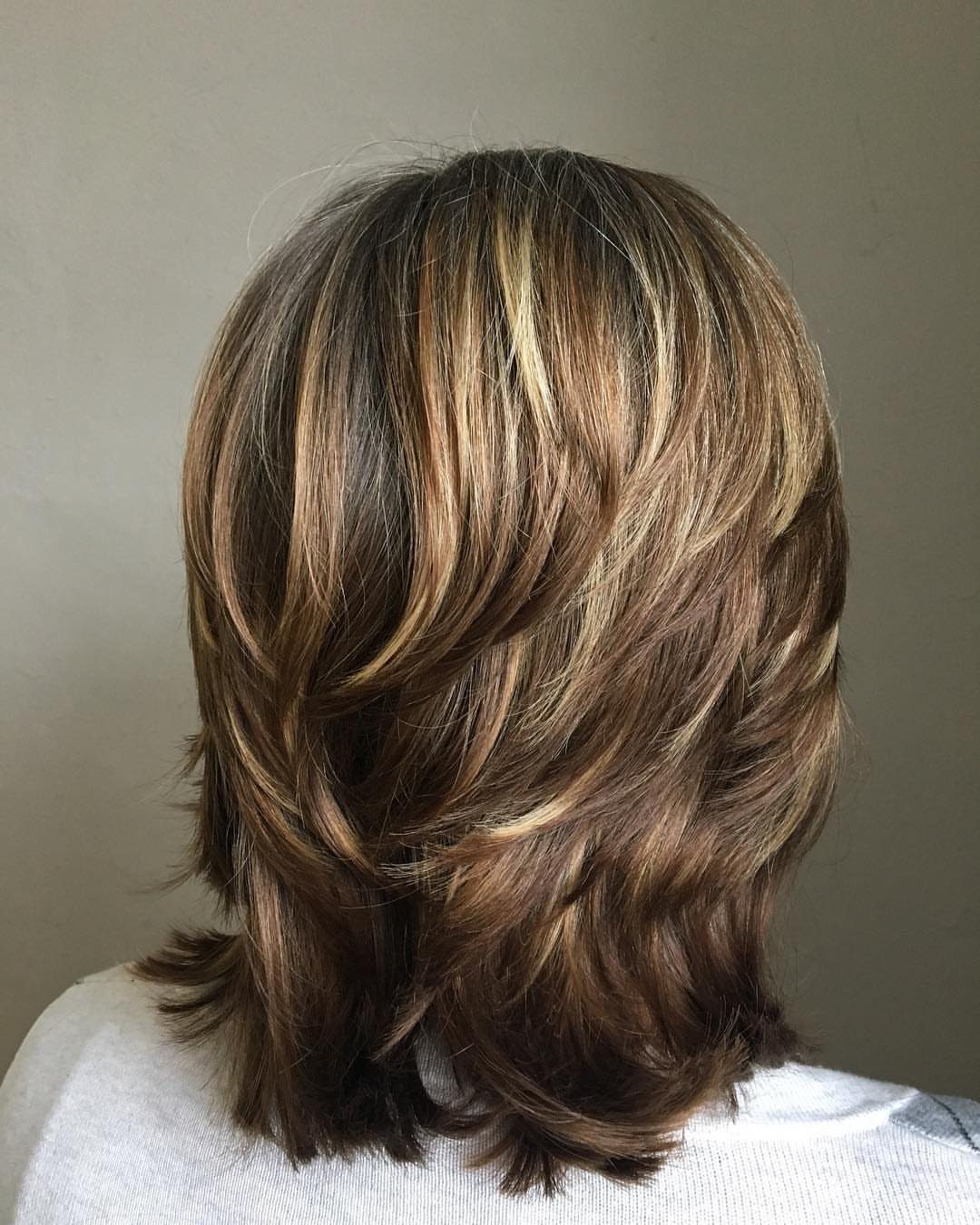 Layered medium shag haircut with blended ash-brown and beige highlights