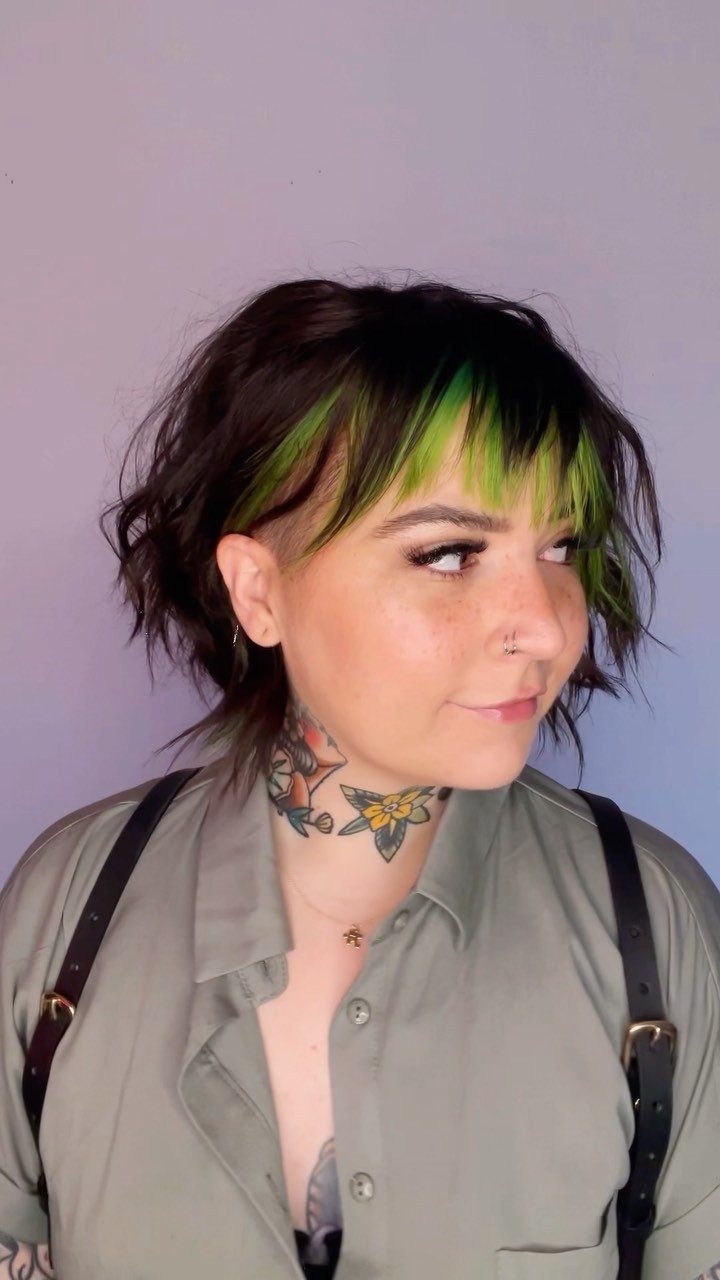 Short dark shag with green fringe and a closely trimmed side