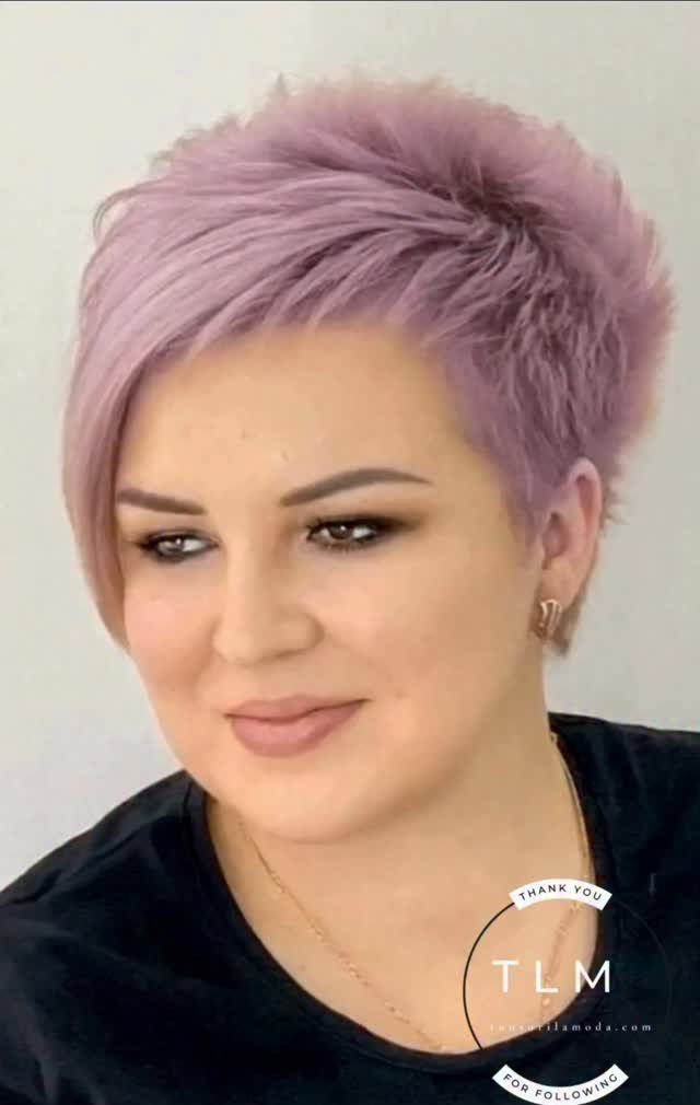 Pastel lavender-pink pixie haircut with textured, swept-over styling