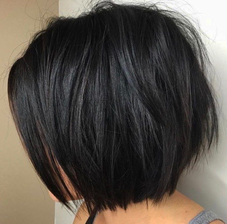Short dark bob with layered choppy ends and wispy texture