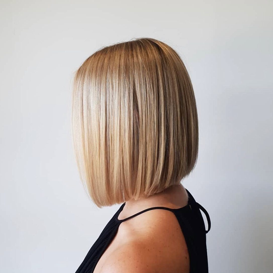 Straight blonde bob with a sleek finish, shown from behind and in profile