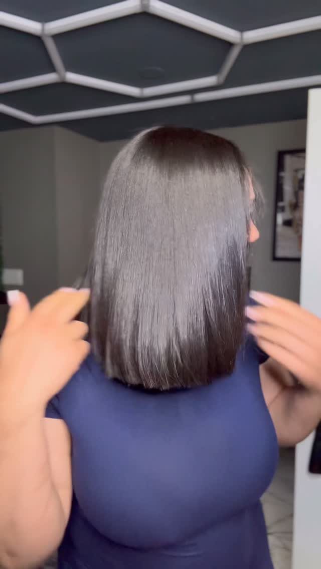 Straight shoulder-length hair with a clean, blunt, even hemline