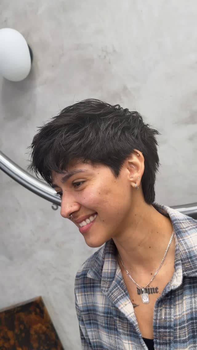Short dark textured crop with a compact top and choppy fringe