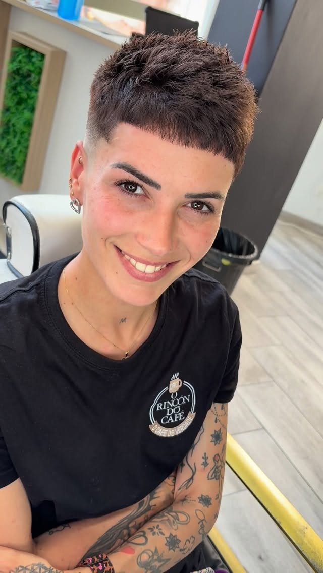 Person showing a choppy dark crop with closely faded sides